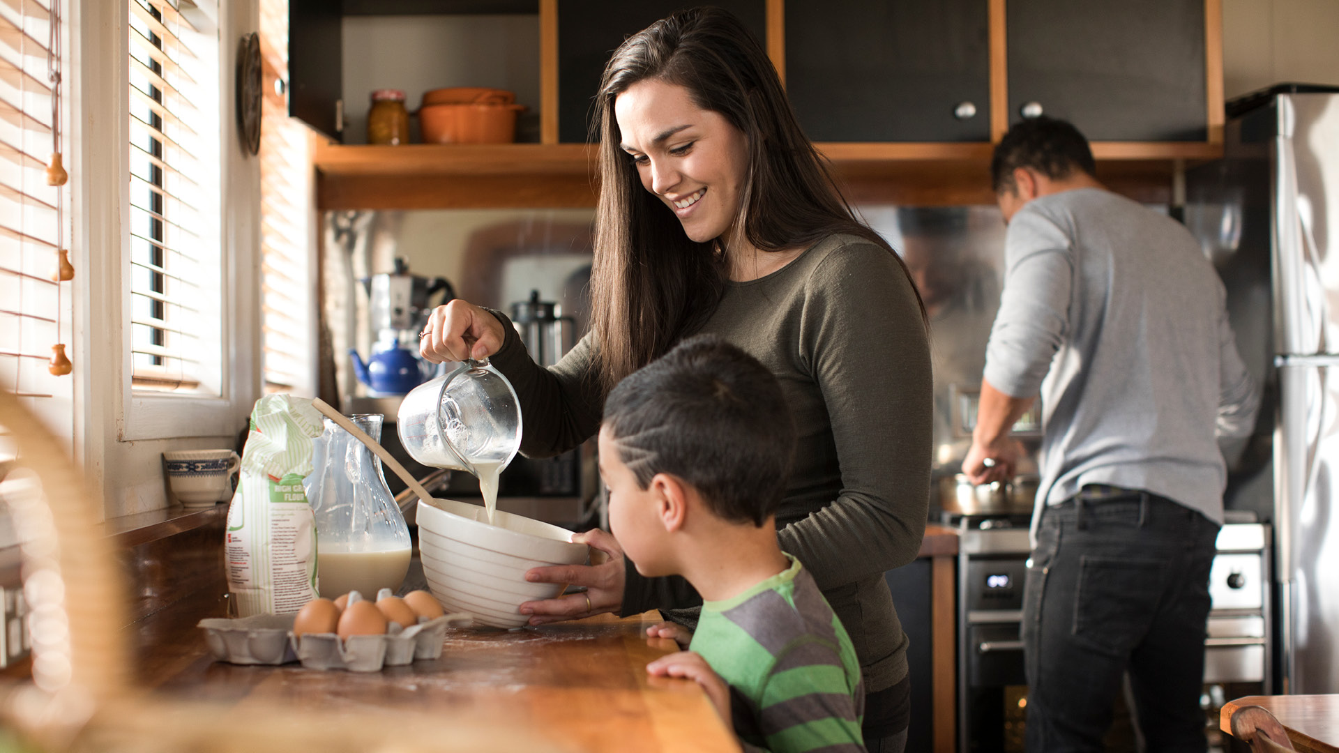 Family baking in kitchen