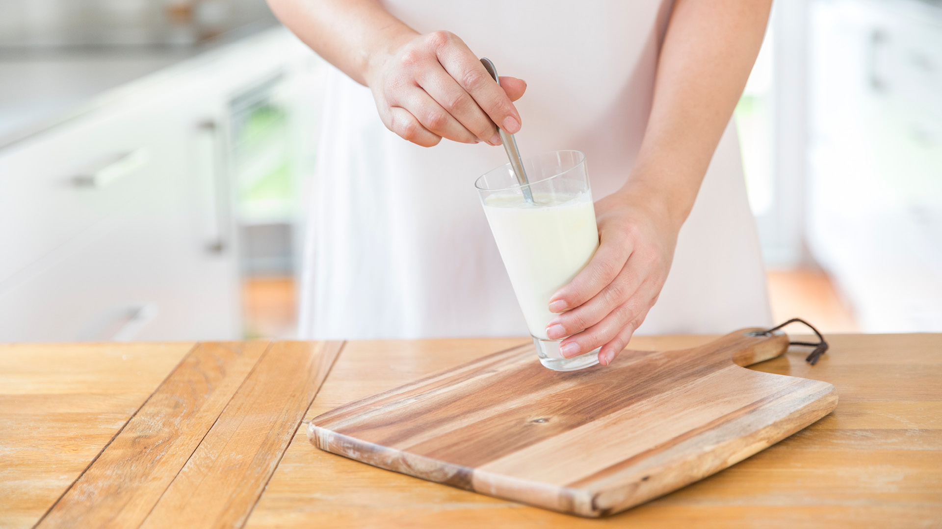 Stirring milk in glass